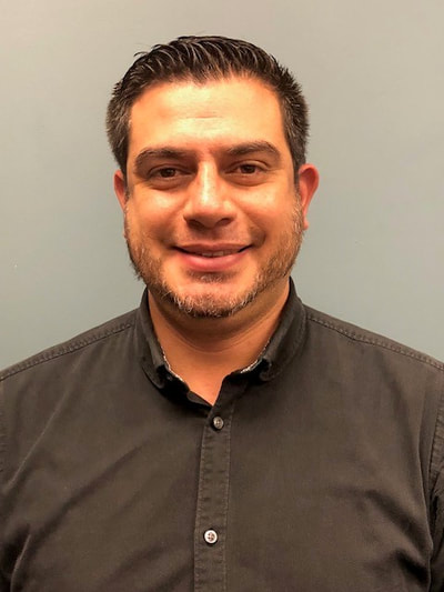 I’m a 37-year-old Latino male with light colored skin.  I am 5’10” tall and weigh 190 lbs. with an average build. My hair is short, dark brown, and my eyes are light brown. I have a brown beard cut short with some white hair in it.  In the photo I am smiling and wearing a black shirt.