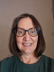 Debra, smiling
